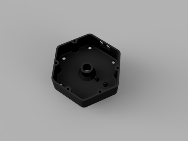 The inside of the base (showing gas outlets and motor mounting hole).